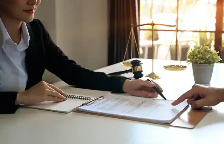 two persons at a desk