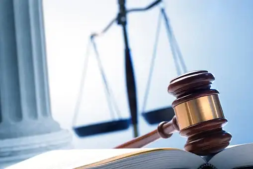  a gavel, scales of justice, and law books